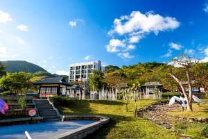 a view of a park with a building in the background at Samiling Resort in Checheng