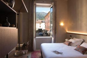 Postel nebo postele na pokoji v ubytování Paradis Pietrasanta