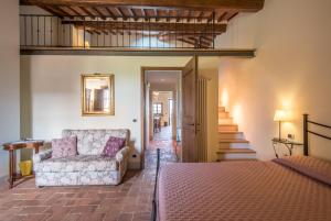 Postel nebo postele na pokoji v ubytování Torre di Corsanello