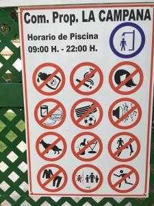 a sign with various prohibited signs on it at LA CAMPANA in Orihuela Costa