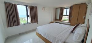 Postel nebo postele na pokoji v ubytování Aries Hotel