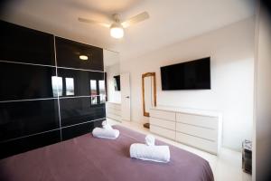 Posteľ alebo postele v izbe v ubytovaní Apartamento Arkadio