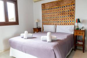 Posteľ alebo postele v izbe v ubytovaní Apartamento Arkadio