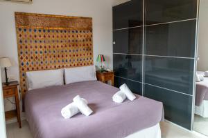 Posteľ alebo postele v izbe v ubytovaní Apartamento Arkadio