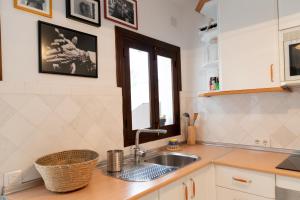 Kuchyňa alebo kuchynka v ubytovaní Apartamento Arkadio + 37 fotografií