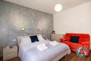 En eller flere senge i et værelse på Bienvenue à Silvi - la casa accogliente