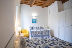 Postel nebo postele na pokoji v ubytování Appartamento Mascalzone Latino - HelloElba