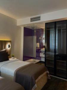 Postel nebo postele na pokoji v ubytování Bayer's City Hotel