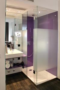 a bathroom with a sink and a shower at Bayer's City Hotel in Munich