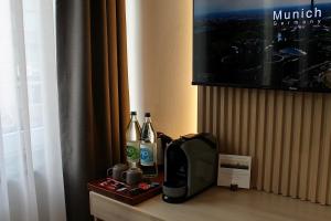 TV a/nebo společenská místnost v ubytování Bayer's City Hotel