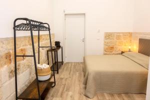 A bed or beds in a room at Apulian House