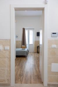 A bed or beds in a room at Apulian House