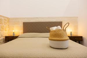 A bed or beds in a room at Apulian House