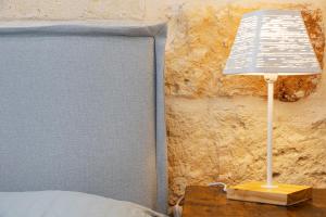 A bed or beds in a room at Apulian House