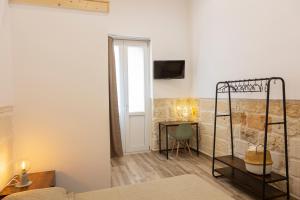 A bed or beds in a room at Apulian House