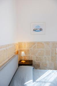 A bed or beds in a room at Apulian House