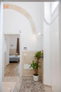 A bed or beds in a room at Apulian House