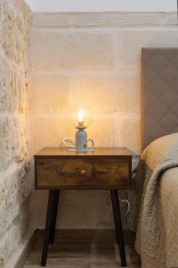 A bed or beds in a room at Apulian House