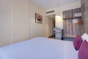 7 Apple Hotel, Vadodara客房内的一张或多张床位