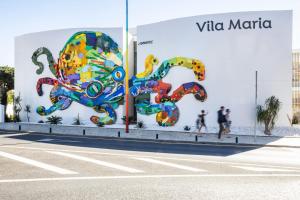 a wall with a painting of an octopus on it at Vila Maria Hotel - Adults Only in Albufeira