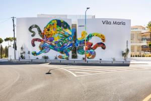 a building with a painting of an octopus on it at Vila Maria Hotel - Adults Only in Albufeira