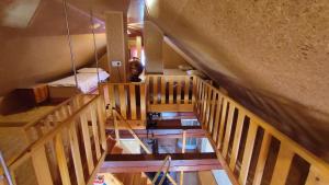 an overhead view of a room with wooden stairs at Apartman Vesna in Veliki Vrh