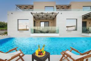 The swimming pool at or close to Serenity Suites Sea View Houses
