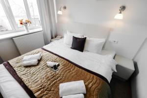 Postel nebo postele na pokoji v ubytování Happy Inn