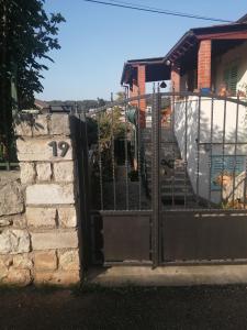 a gate in front of a house with a yard at Fioretta in Mali Lošinj