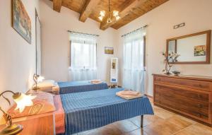 A bed or beds in a room at Agriturismo Cà Ferro