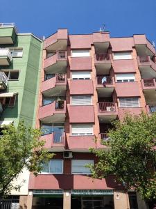 a tall building with balconies on the side of it at Apartment Sagrera in Barcelona