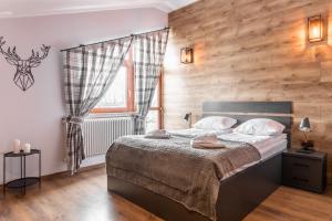 מיטה או מיטות בחדר ב-Apartament Top Zakopane