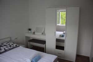 Postel nebo postele na pokoji v ubytování Apartments Bonaca Rovanjska