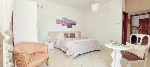 Postel nebo postele na pokoji v ubytování B&B Maison Blanche