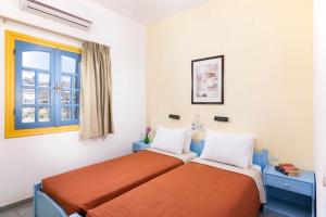 Posteľ alebo postele v izbe v ubytovaní Afroditi Apartments