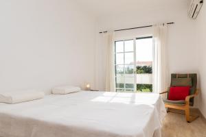 En eller flere senge i et værelse på Villa Oriente by ALGARVEMANTA