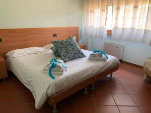 Postel nebo postele na pokoji v ubytování Al Borgo + 37 fotografií