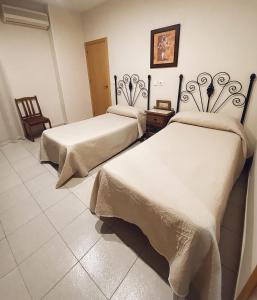 Posteľ alebo postele v izbe v ubytovaní Hostal Restaurante El Paso