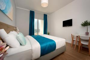 Postel nebo postele na pokoji v ubytování Garni Hotel Larimar
