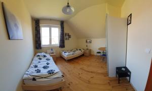 Posteľ alebo postele v izbe v ubytovaní Villa Leika - Panoramablick am Riesengebirge