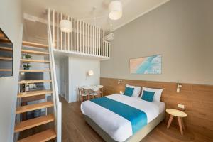 Postel nebo postele na pokoji v ubytování Garni Hotel Larimar