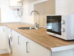Kuchyňa alebo kuchynka v ubytovaní Global Properties, Increible apartamento con vistas al mar, Canet d'en Berenguer