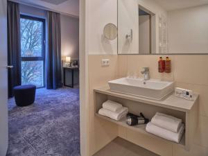 Ein Badezimmer in der Unterkunft Dorint Parkhotel Frankfurt / Bad Vilbel