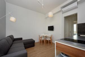 TV a/nebo společenská místnost v ubytování Garni Hotel Larimar