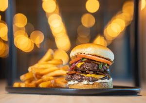 a cheeseburger and french fries on a plate at Viking Line ferry Viking Glory - Mini-cruise from Stockholm in Stockholm +42 photos