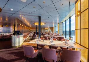 a dining room with a long table and chairs at Viking Line ferry Viking Glory - Mini-cruise from Stockholm in Stockholm
