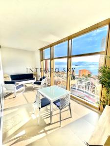 a living room with a view of the city at INTEMPO SKY Resort & Spa in Benidorm