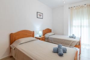 Postel nebo postele na pokoji v ubytování Edificio Menorca + 17 fotografií