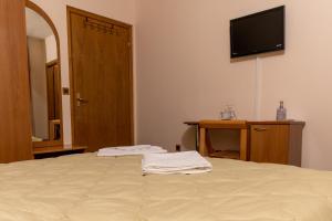 Postel nebo postele na pokoji v ubytování Hotel Kanet