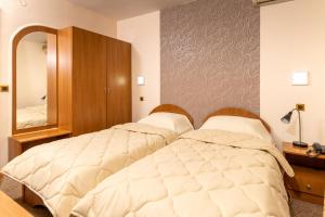 Postel nebo postele na pokoji v ubytování Hotel Kanet